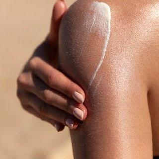 women using sun defence body sunscreen